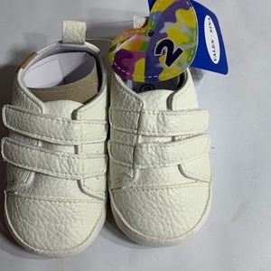 Caleb Sina cut shoes for baby